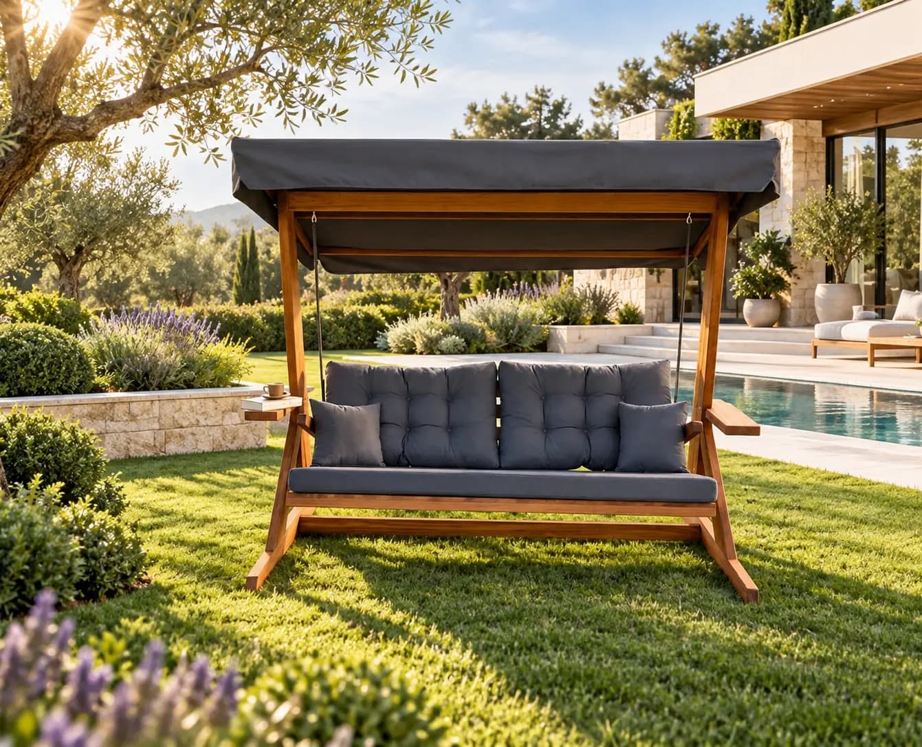 Mihenk 2400 solid iroko swing in a villa garden with olive trees, anthracite cushion (digital staging)